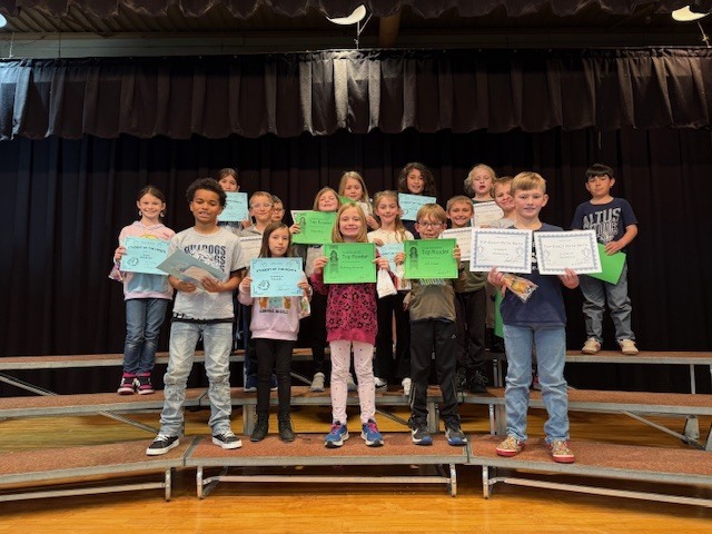 Students with certificates.