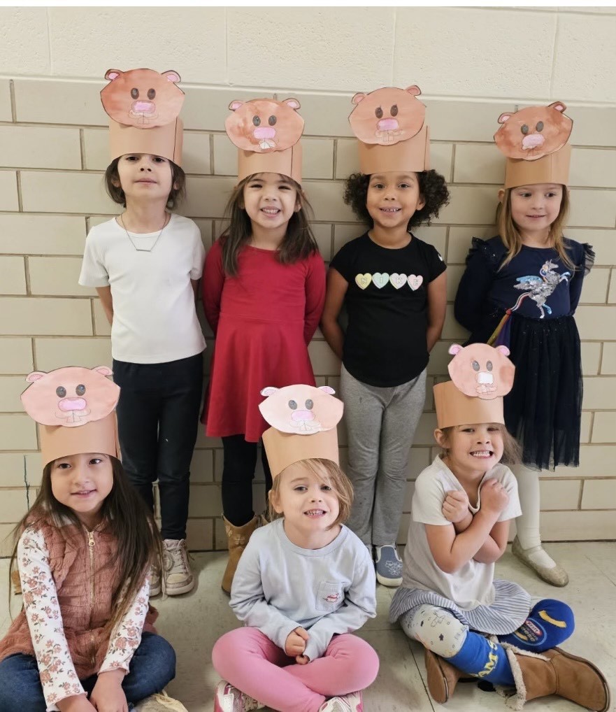 Students wearing hats.