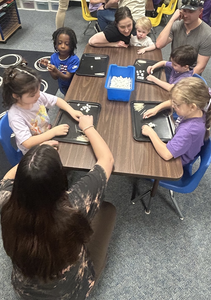 Students doing STEAM with parents.