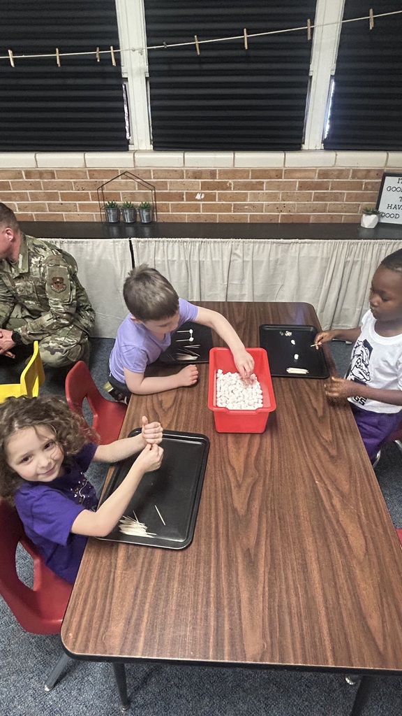 Students doing STEAM with parents.