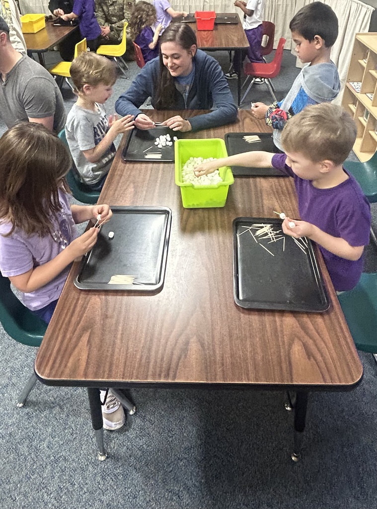 Students doing STEAM with parents.