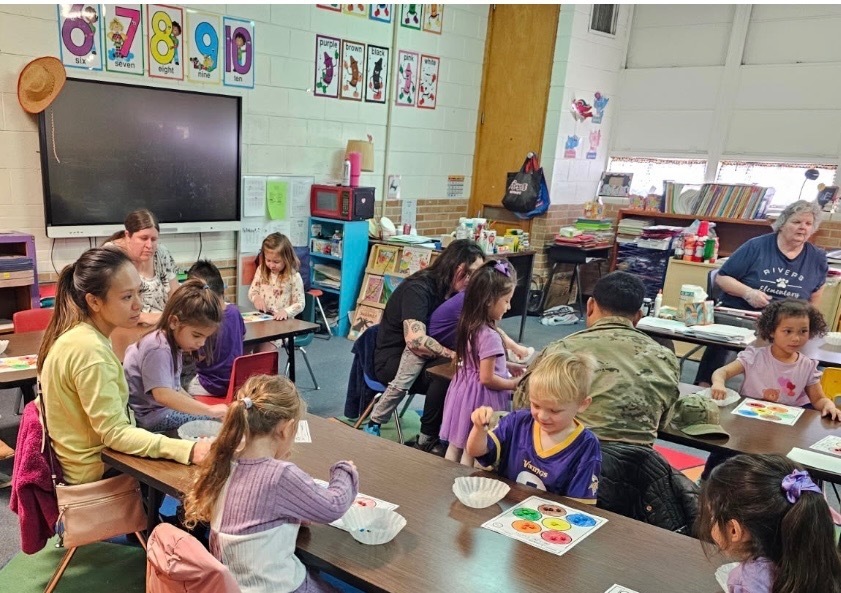 Students doing STEM with parents.