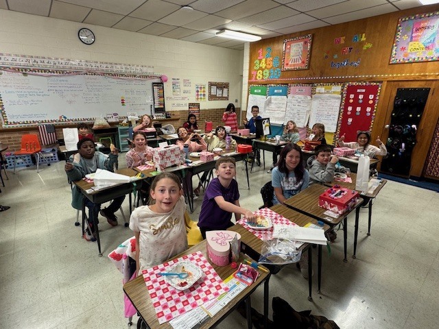 Students having an ice cream party.