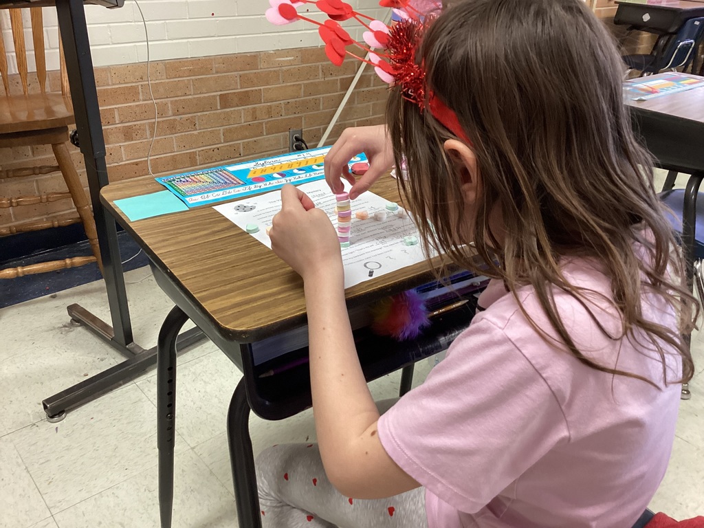 Student playing a valentine game.