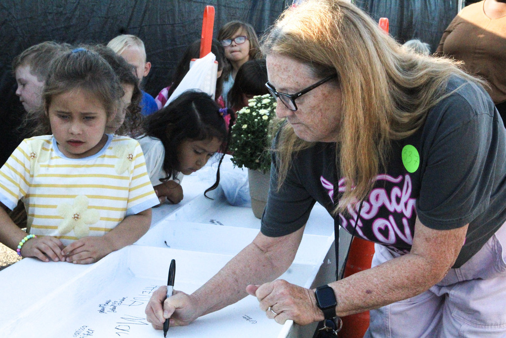 Mrs. Byrd signs her name