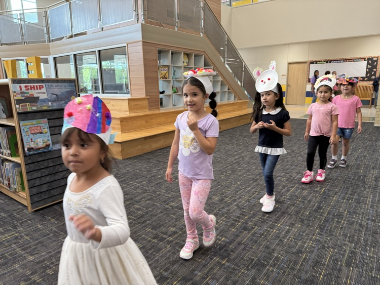 Students wearing handmade hats.