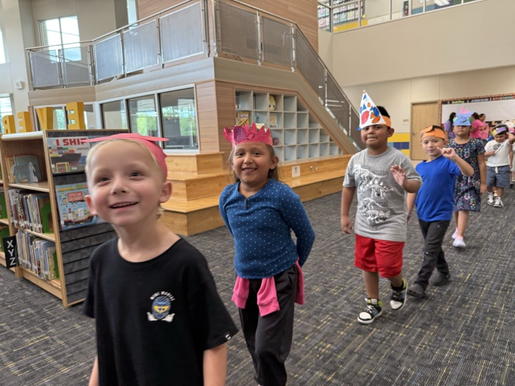 Students wearing handmade hats.