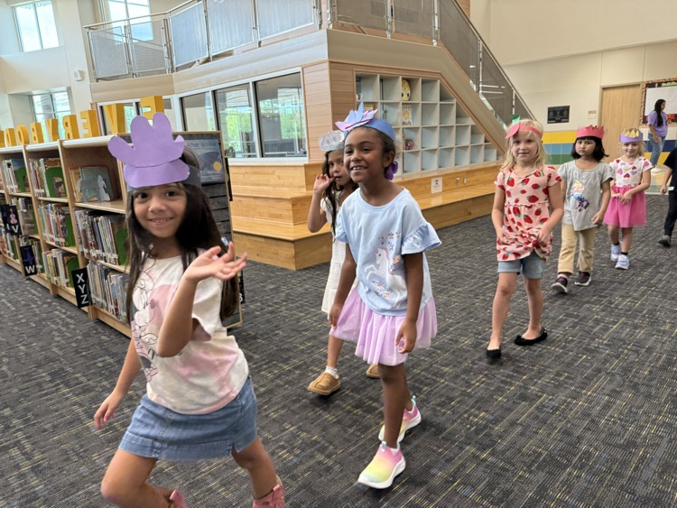 Students wearing handmade hats.