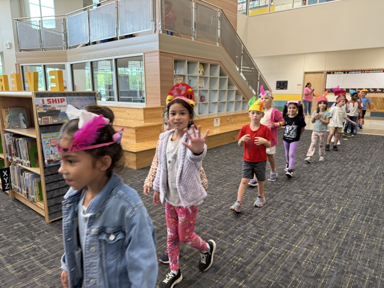 Students wearing handmade hats.