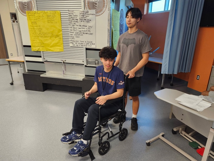 student working in wheelchair skills for CNA