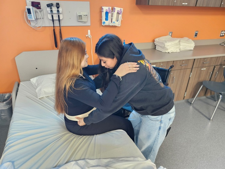 student working in wheelchair skills for CNA