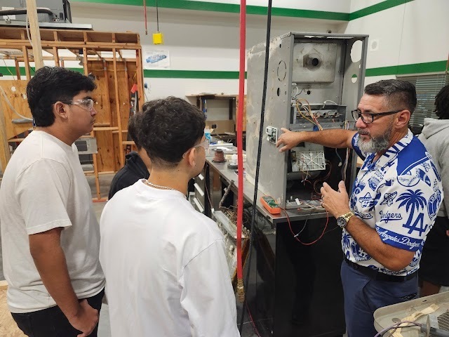 Student working on wiring/electrical skills in HVAC class