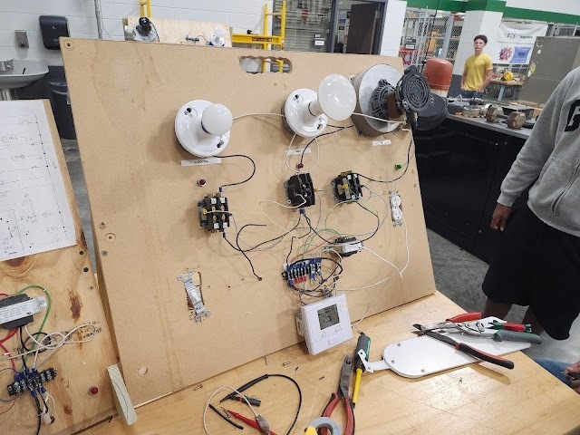 Student working on wiring/electrical skills in HVAC class