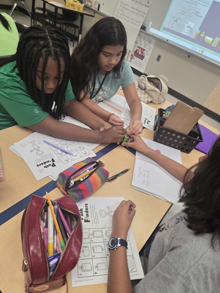 Students working together to build a circuit