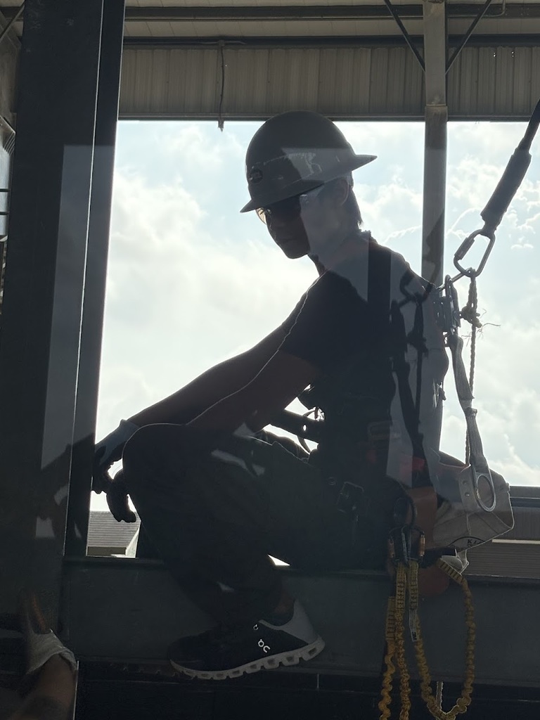 Construction and welding students at construction fair.