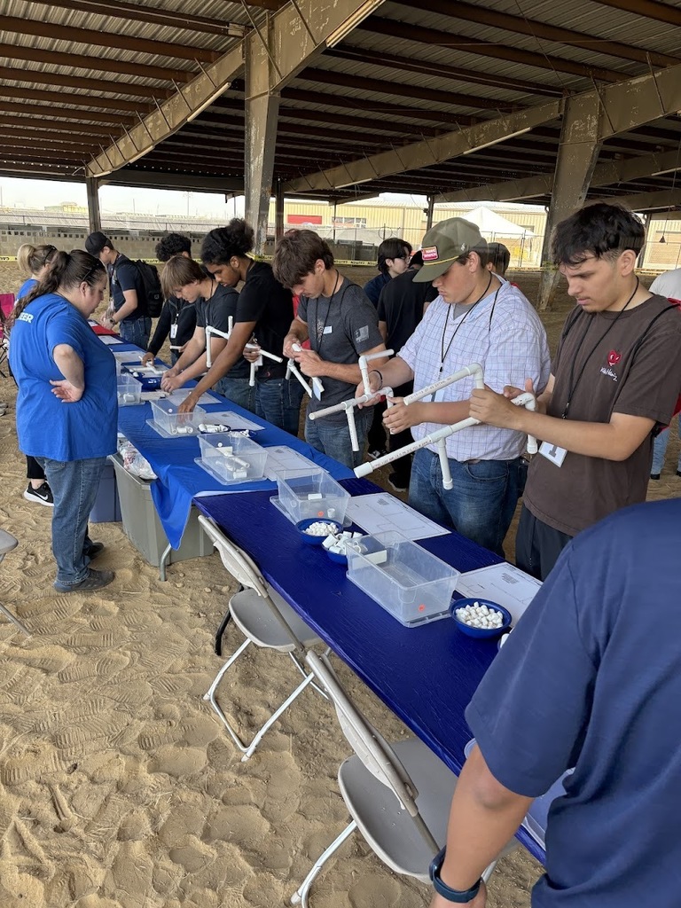 Construction and welding students at construction fair.