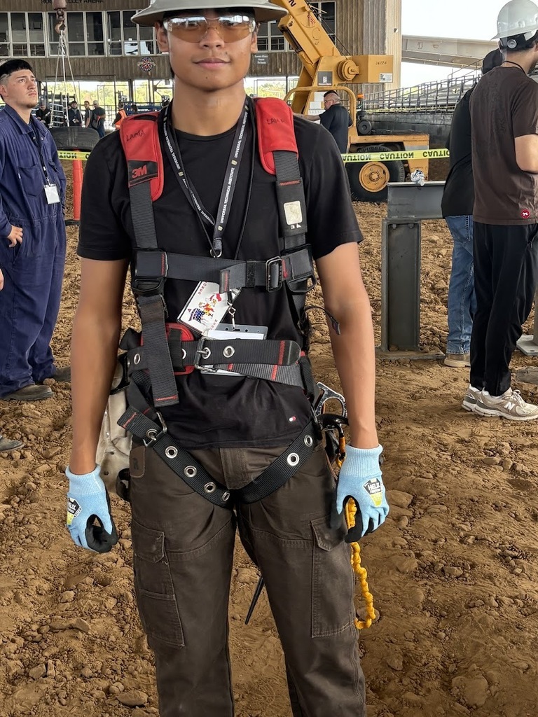 Construction and welding students at construction fair.