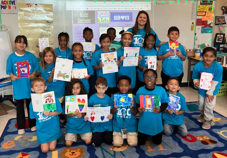 Second grade pictures of students working on their cards for children in the hospital