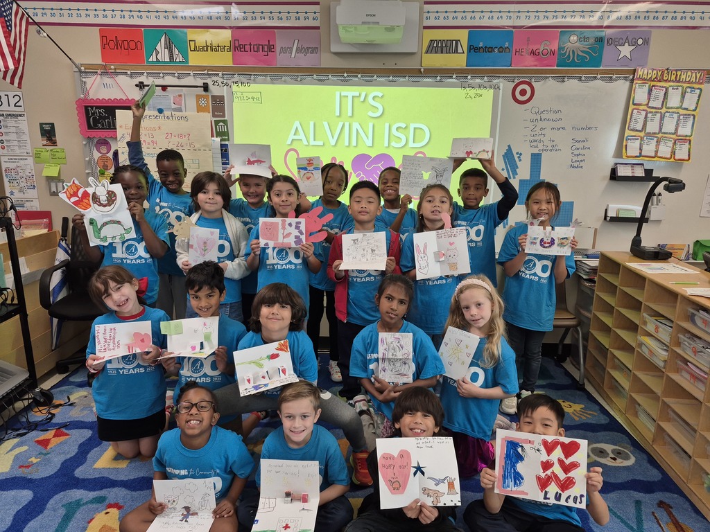 Second grade pictures of students working on their cards for children in the hospital