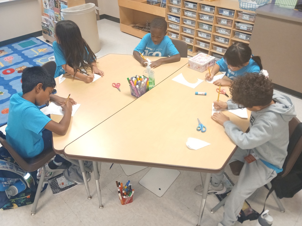 Second grade pictures of students working on their cards for children in the hospital