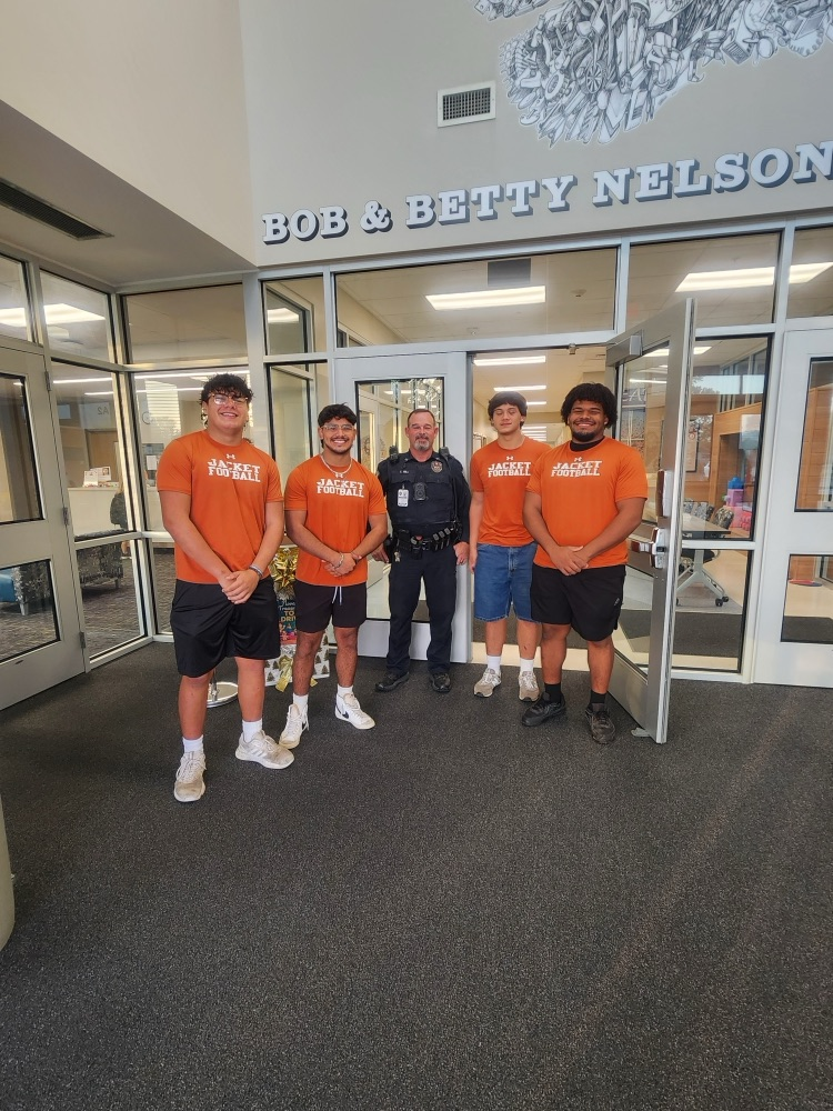 AHS athletes with Officer Hill