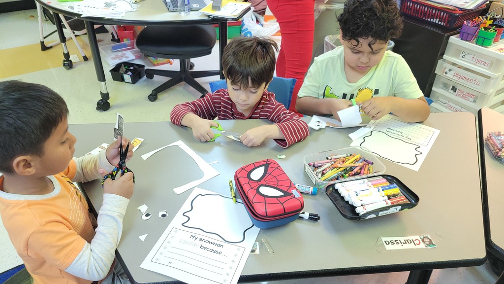 Students working on writing together.