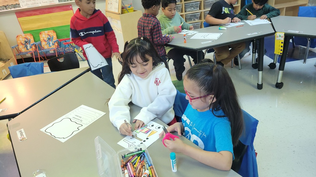 Students working on writing together.