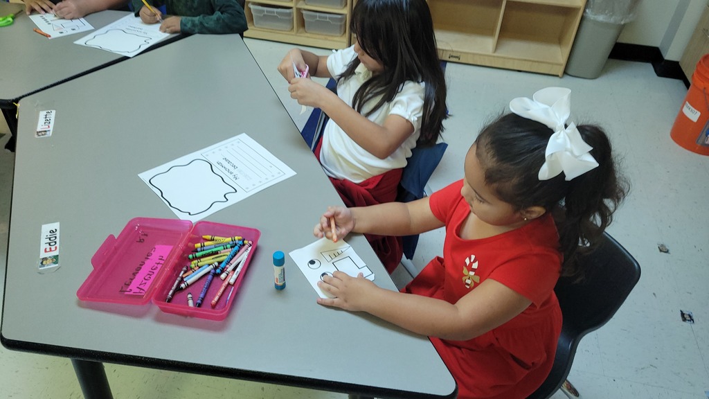 Students working on writing together.