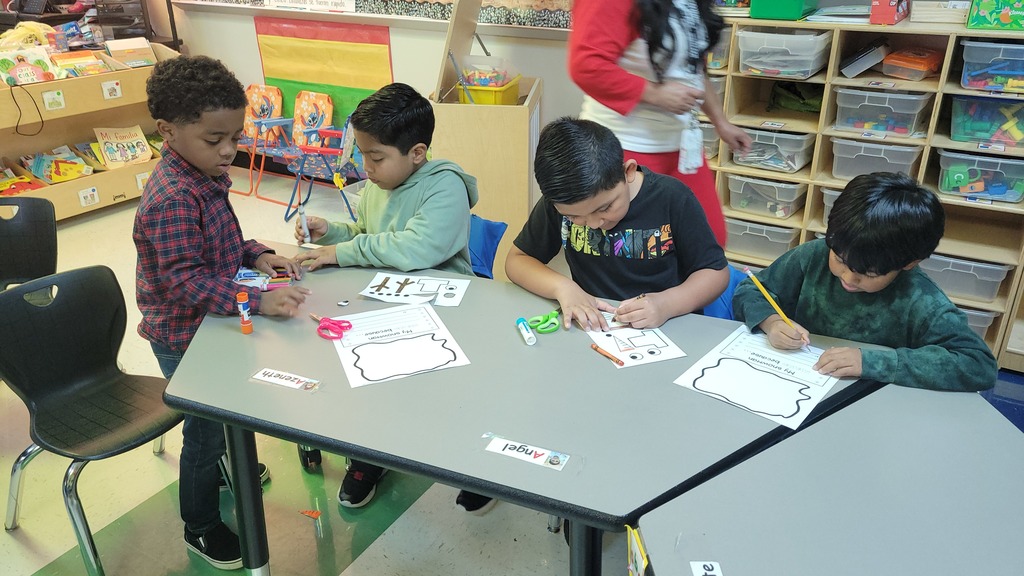 Students working on writing together.