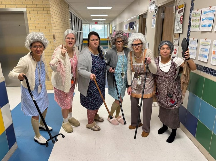 Teachers dressed as old people.