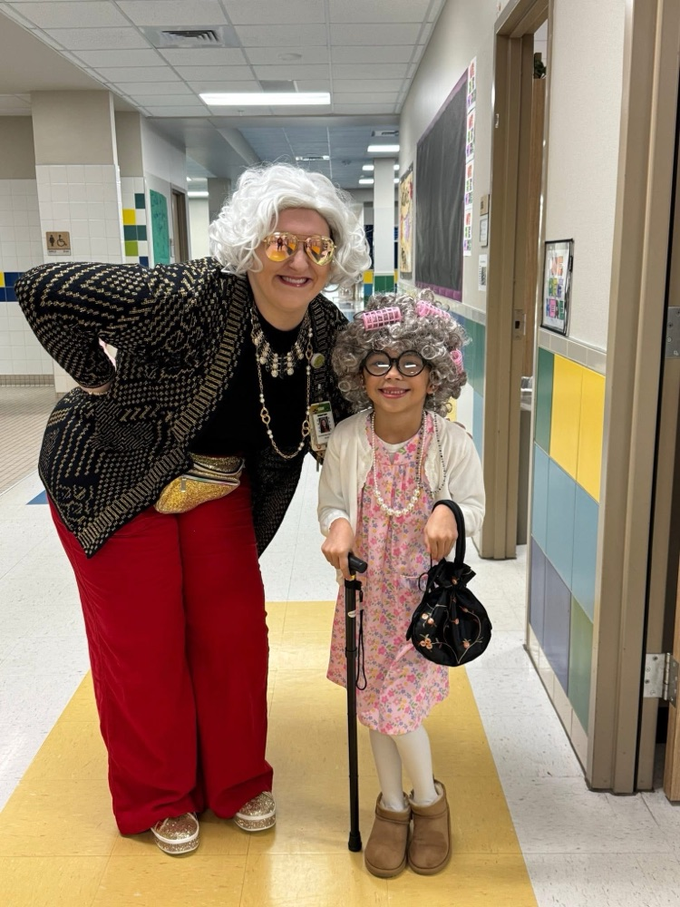 Student and teacher dressed as old people.