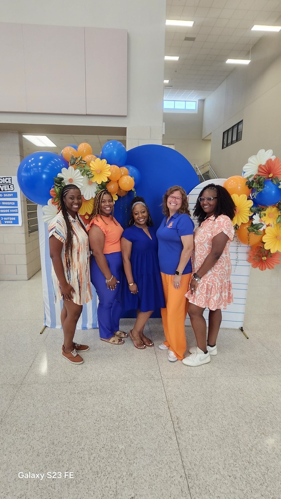 Teachers posing with smiles during back to school activities