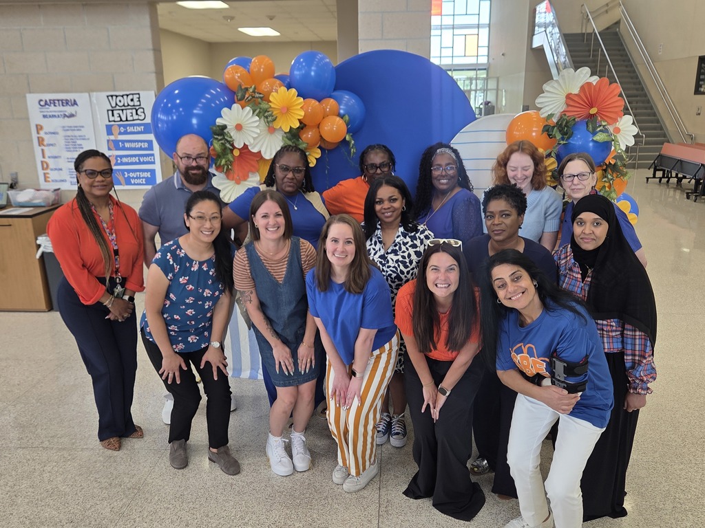 Teachers posing with smiles during back to school activities