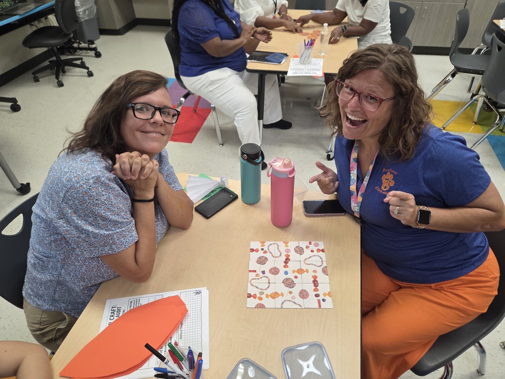 Teachers posing with smiles during back to school activities