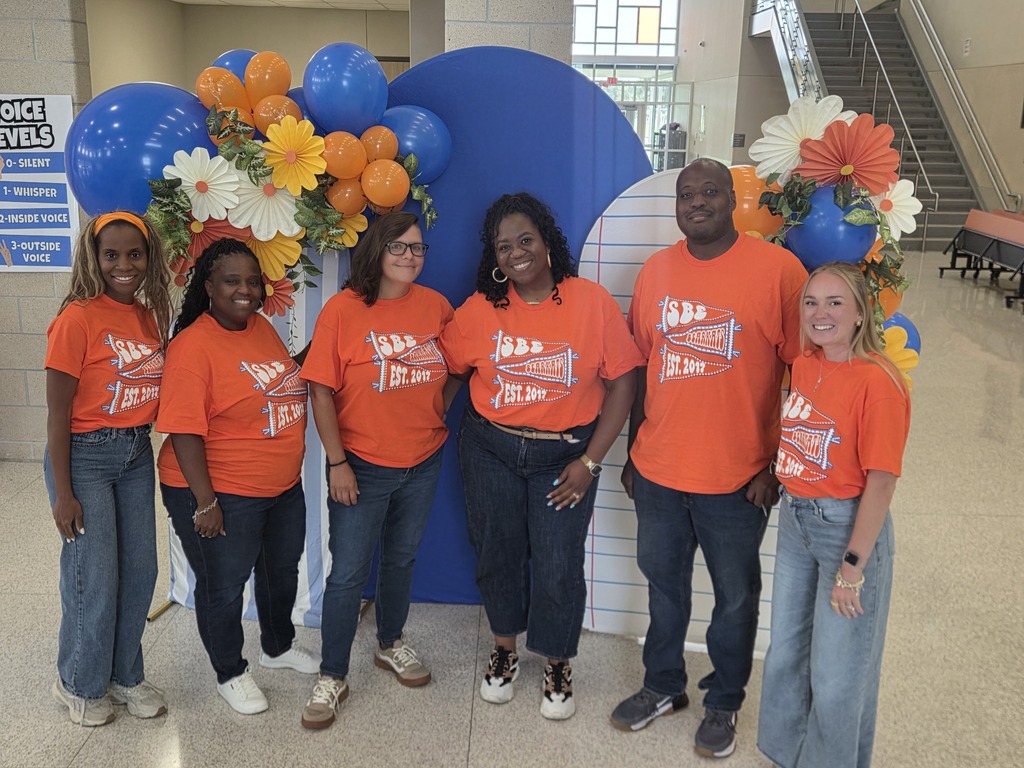 Teachers posing with smiles during back to school activities