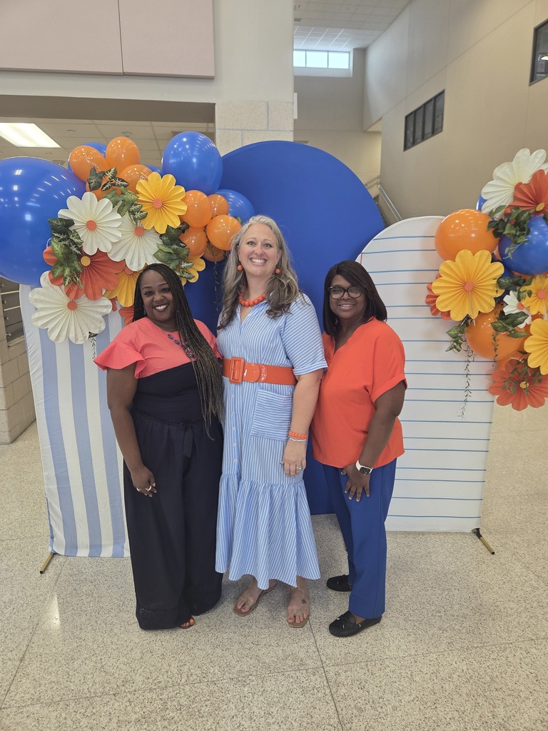 Teachers posing with smiles during back to school activities