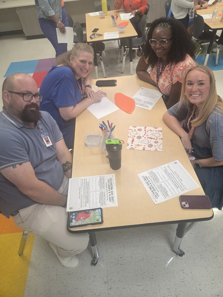 Teachers posing with smiles during back to school activities