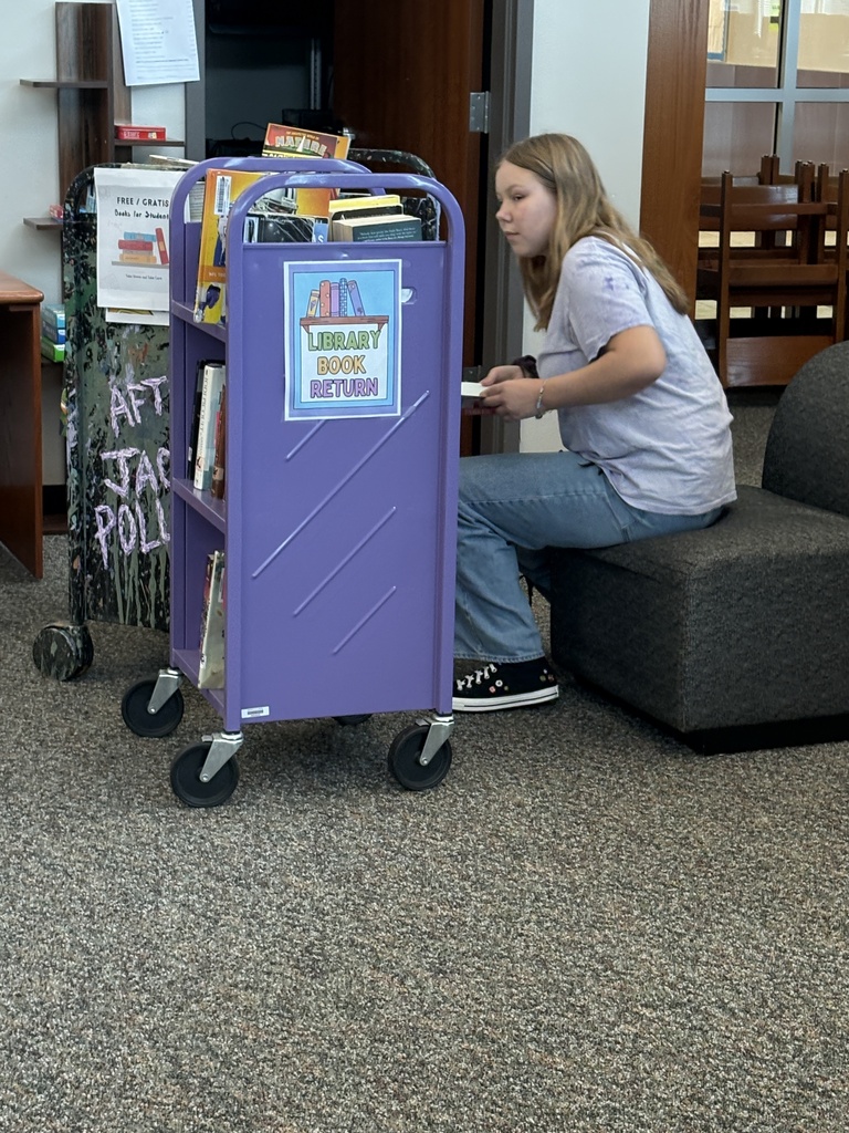Library Aides make the library go round - getting books ready for all our readers!