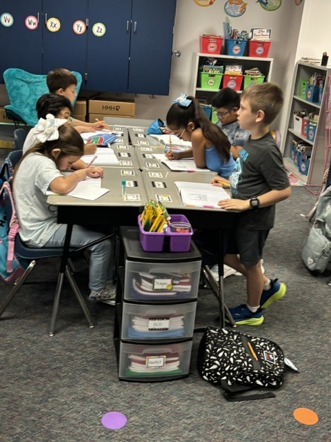 students writing at desk