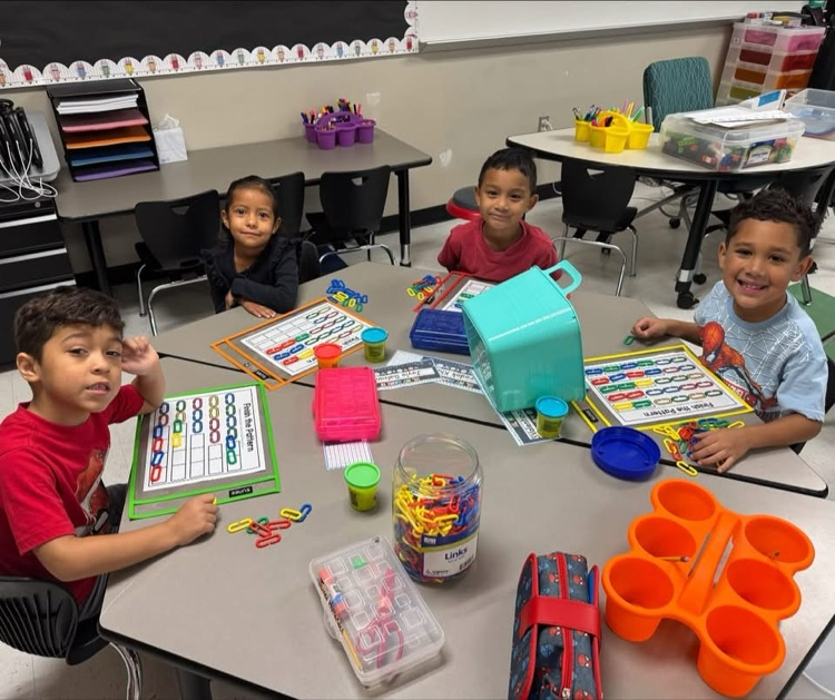 Students learning at math stations