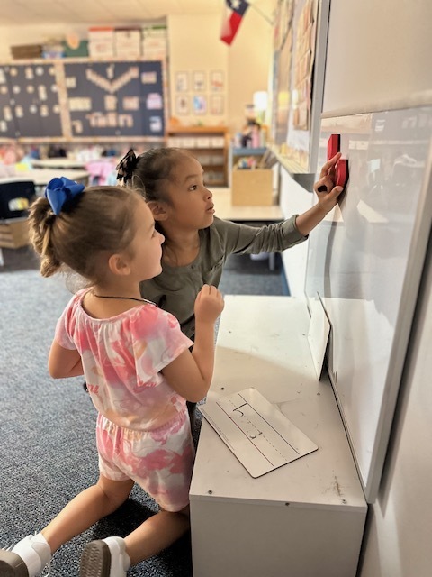 kids working on the board