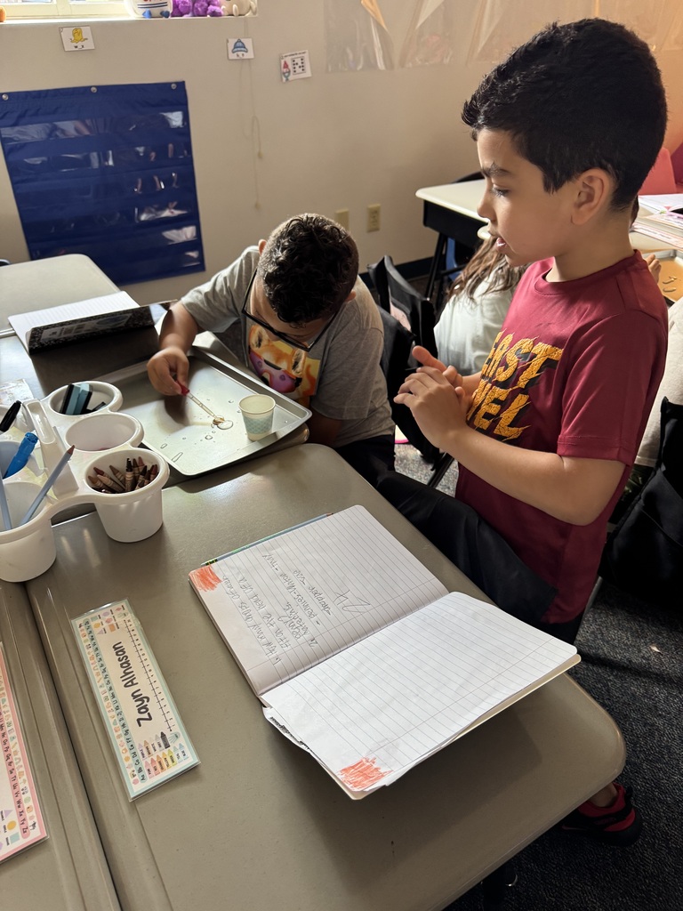 students putting water on penny