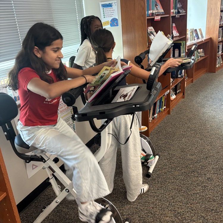 NRJH morning library … in session! Reading and Riding - activating ALL parts of the brain! 