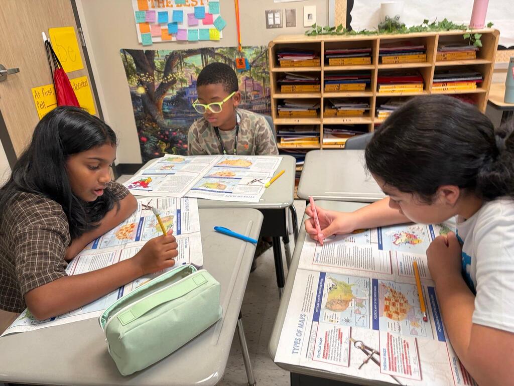 Students exploring different types of maps