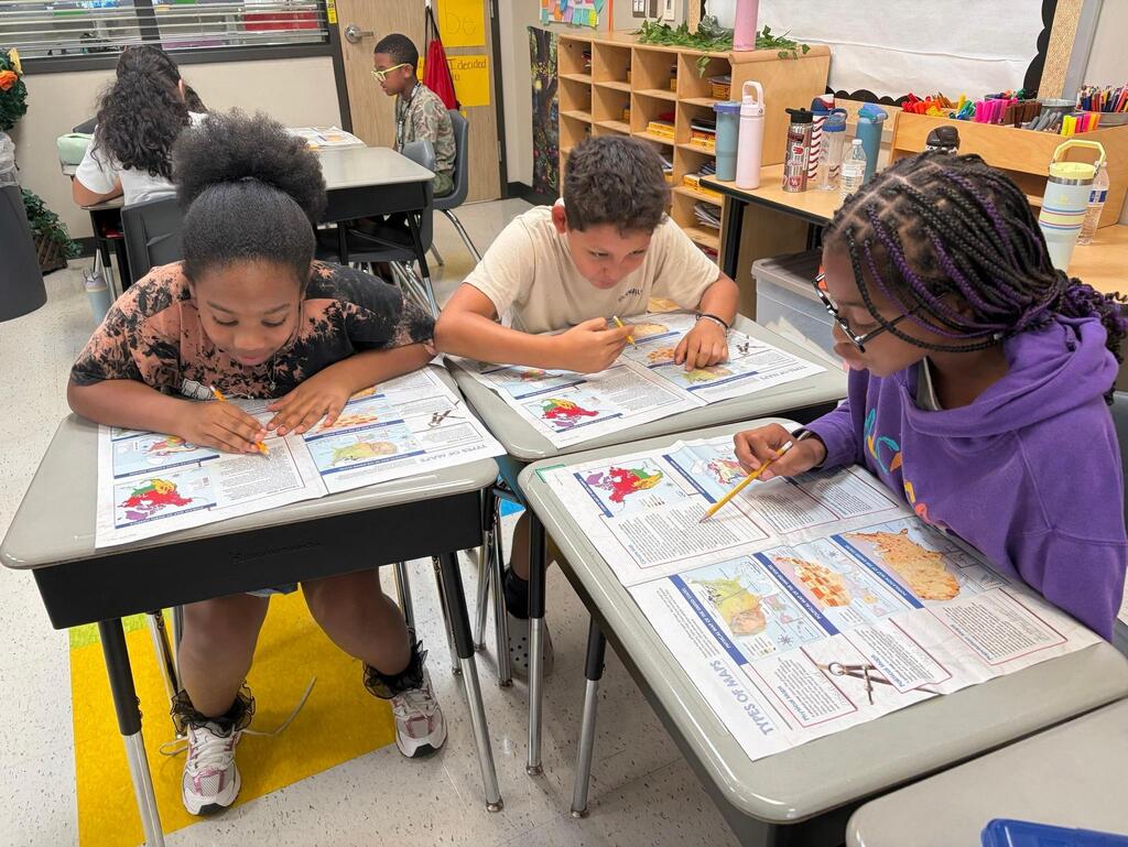 Students exploring different types of maps