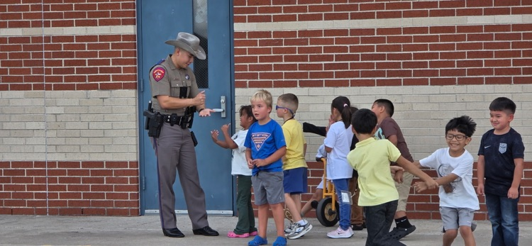 officer playing with kids