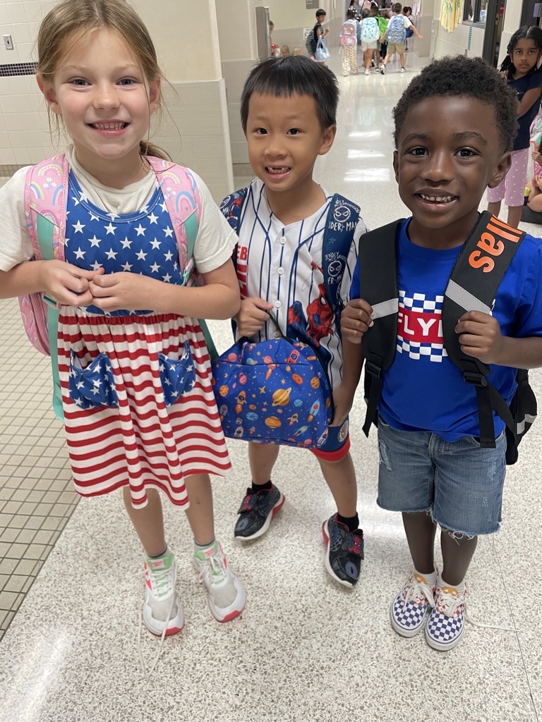 students posing together dressed in patriotic colors for patriots day