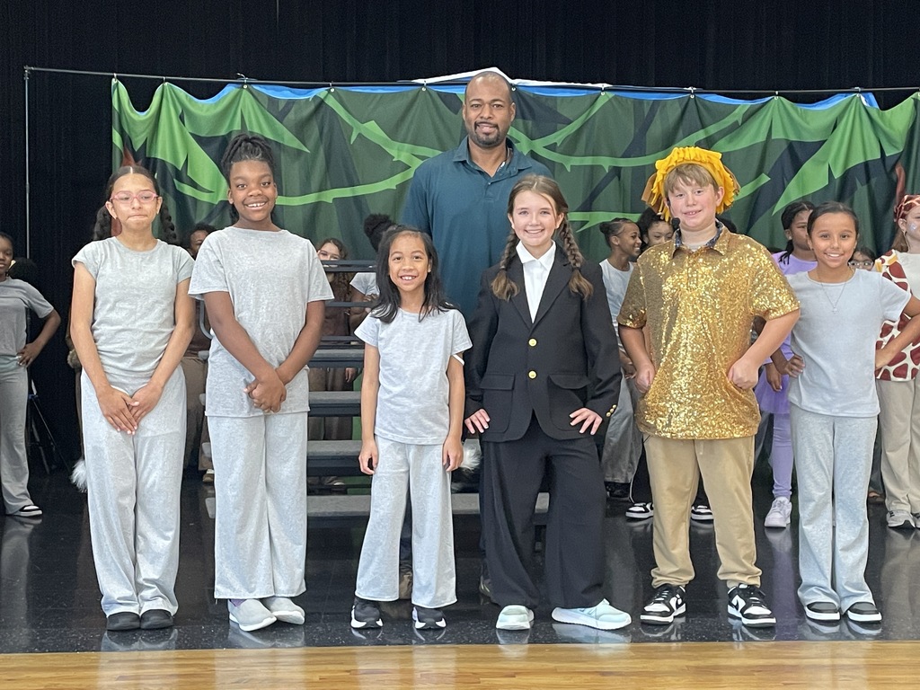 Brothers elementary students posing after performing in the district west side musical, madagascar