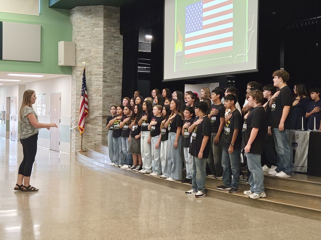 Picture of choir performing the national anthem