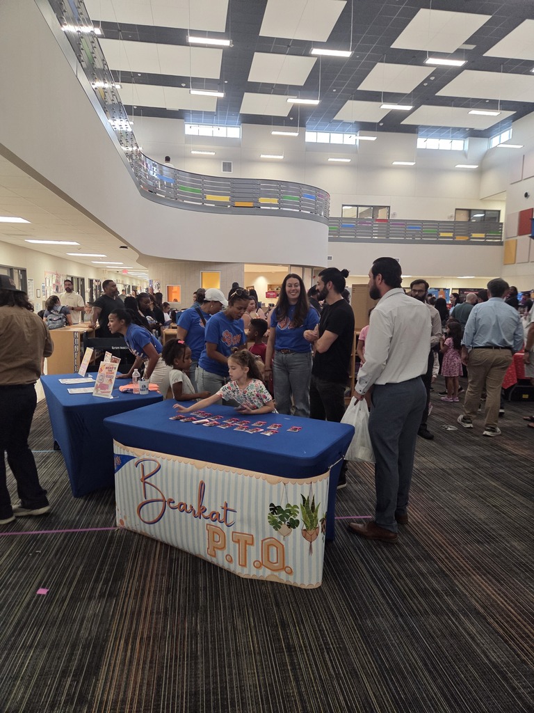 Students and parents in classrooms for Open House.  